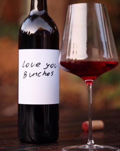 A bottle of wine that says 'love you bunches'
