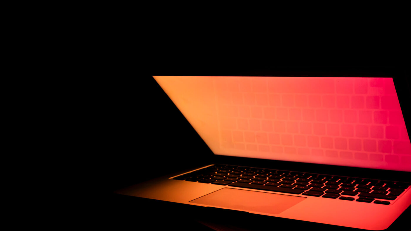open laptop on a dark background