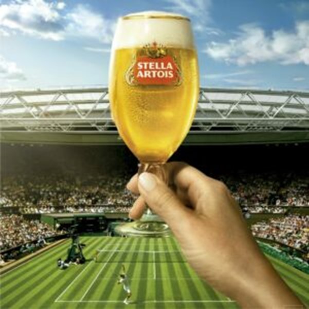 A pint of Stella Artois with a football pitch 
